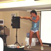 cheif enthusiast John as the iconic fitness guru Richard Simmons pumping out 'Disco Sweat' at the NZ Fitness Convention in Auckland. Richard is hilarious as a 'special guest' at the office with his office aerobics! © enthuse